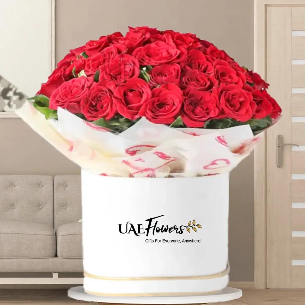50 stems of red roses with white paper wrapping in white box