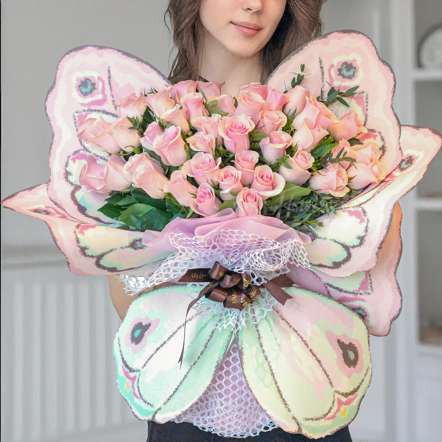 Butterfly Kissed bouquet of 30 pink roses, paired with limonium and green fillers