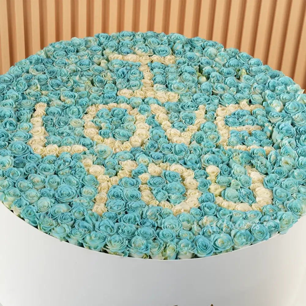 box arrangement of 150 blue and white roses