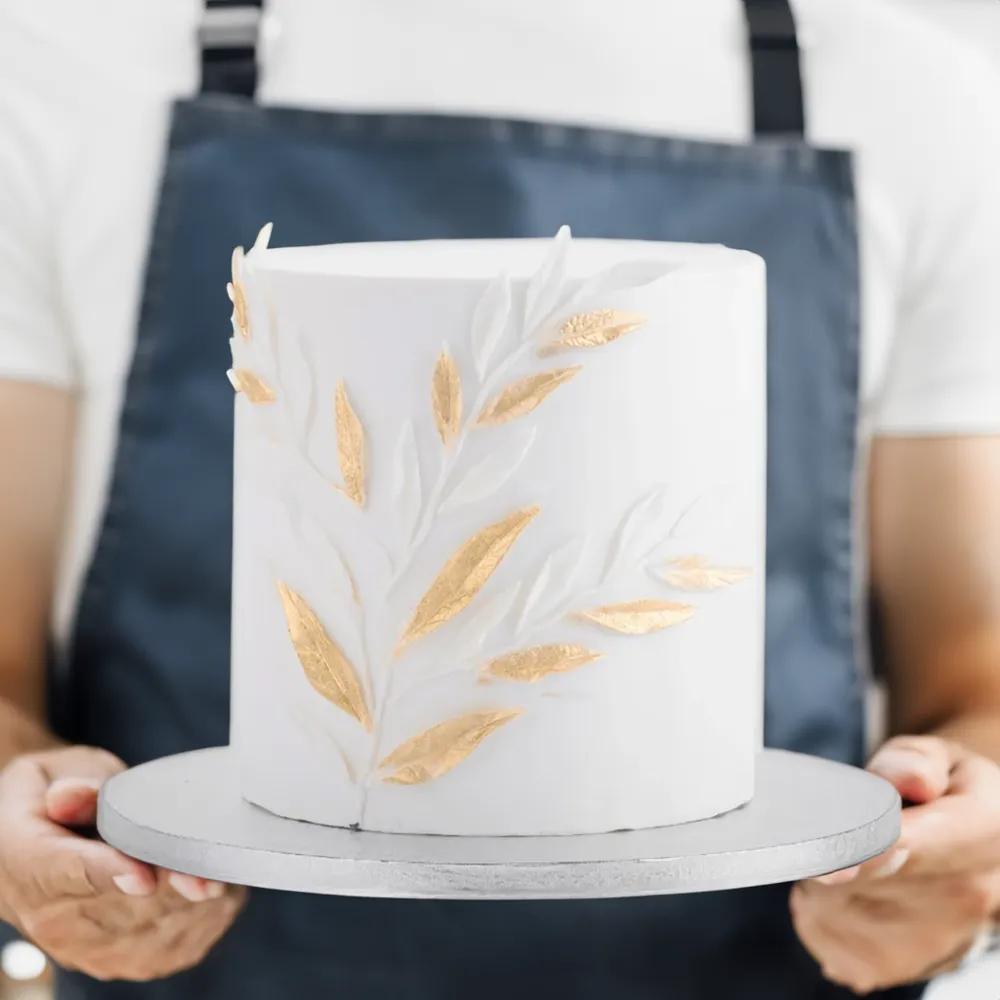 Gold leaf themed 3kg wedding cake decorated with elegant golden accents, perfect for 20–25 guests.