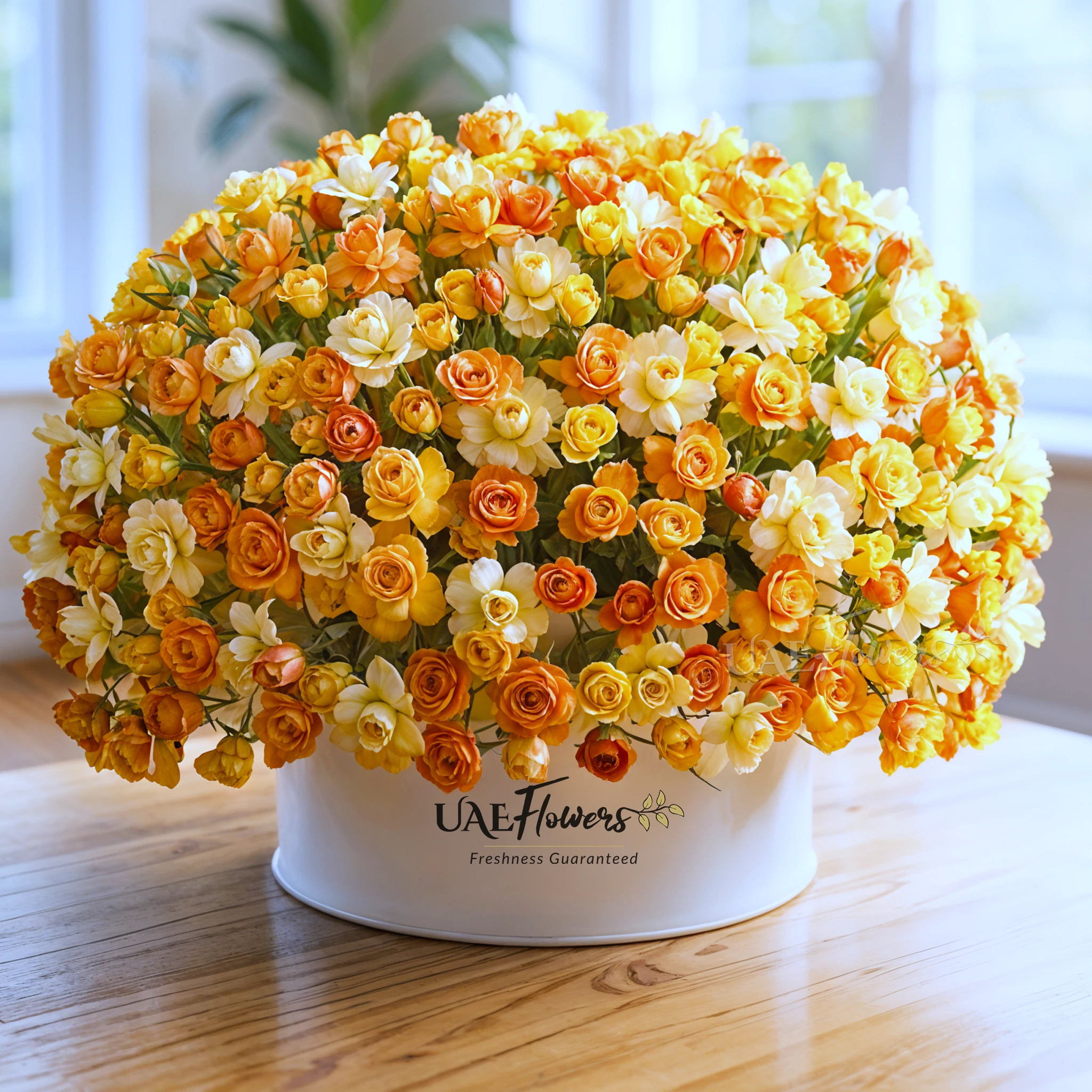 arrangement of 200 peach, yellow, and orange roses with green fillers