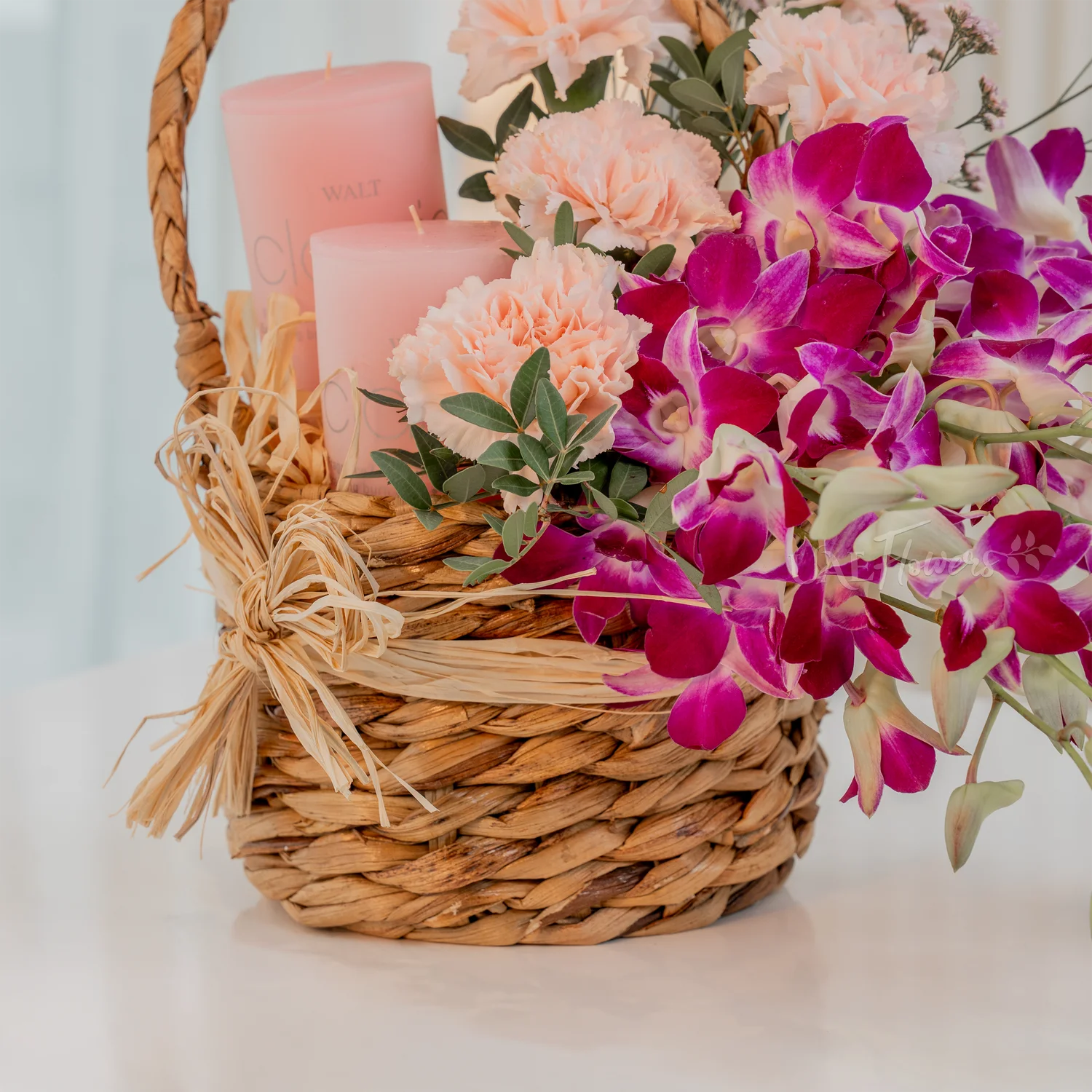 10 purple orchids, 5 pink carnations, 2 pink candles,
