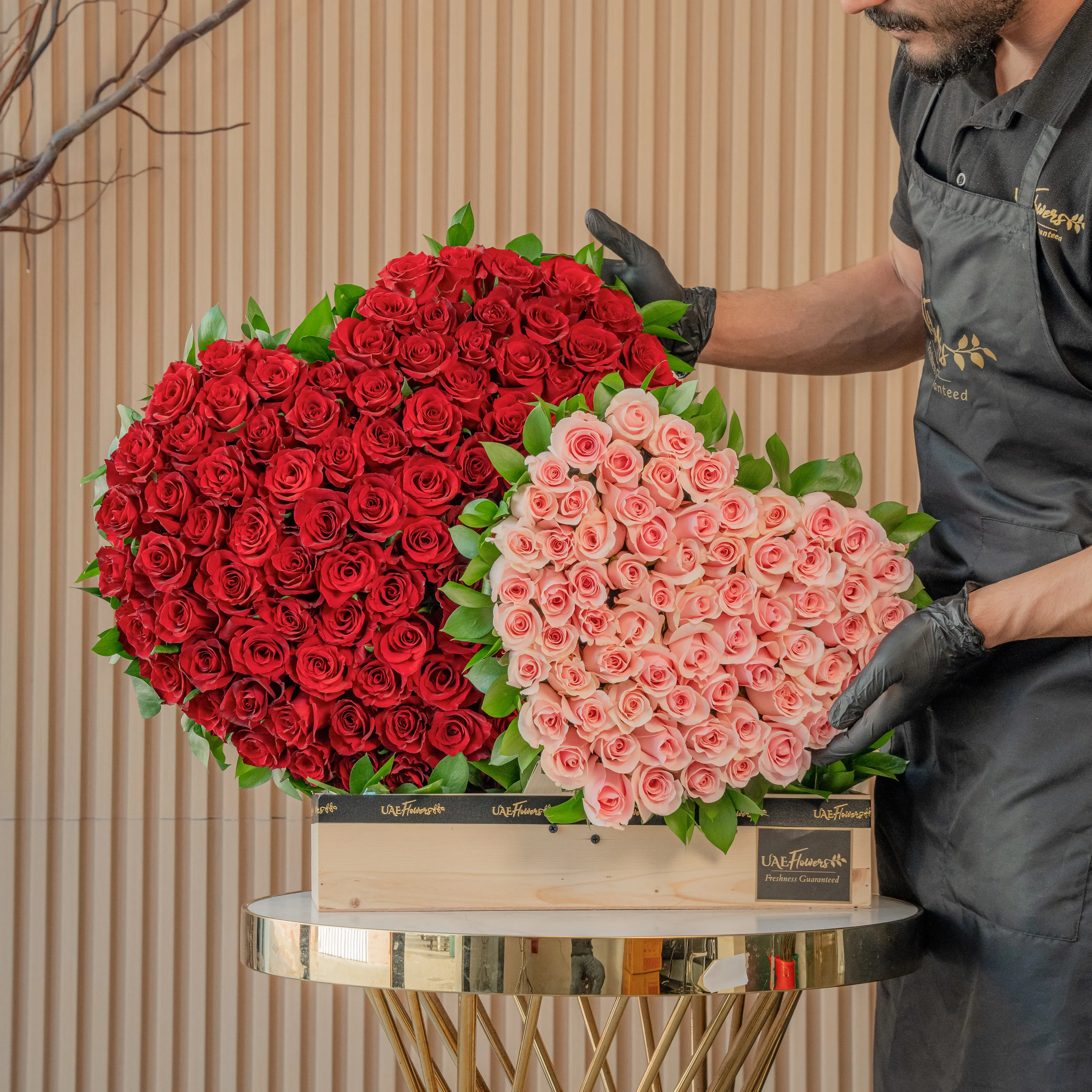 duo heart arrangement has 100 red roses and 50 pink roses