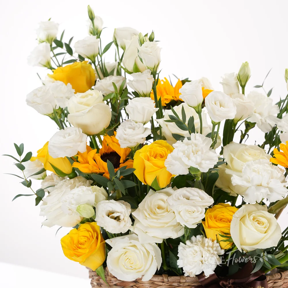 6 white roses, 6 yellow roses, 10 white lisianthus, 2 sunflowers
