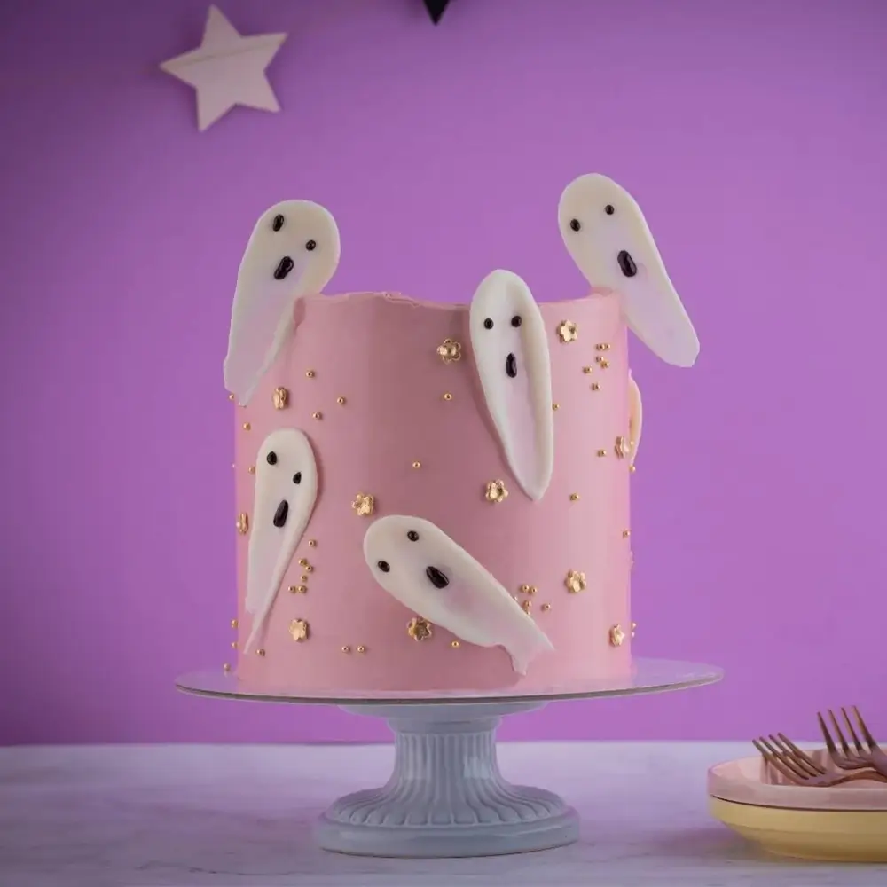 A pink ghost cake weighing 2 kg