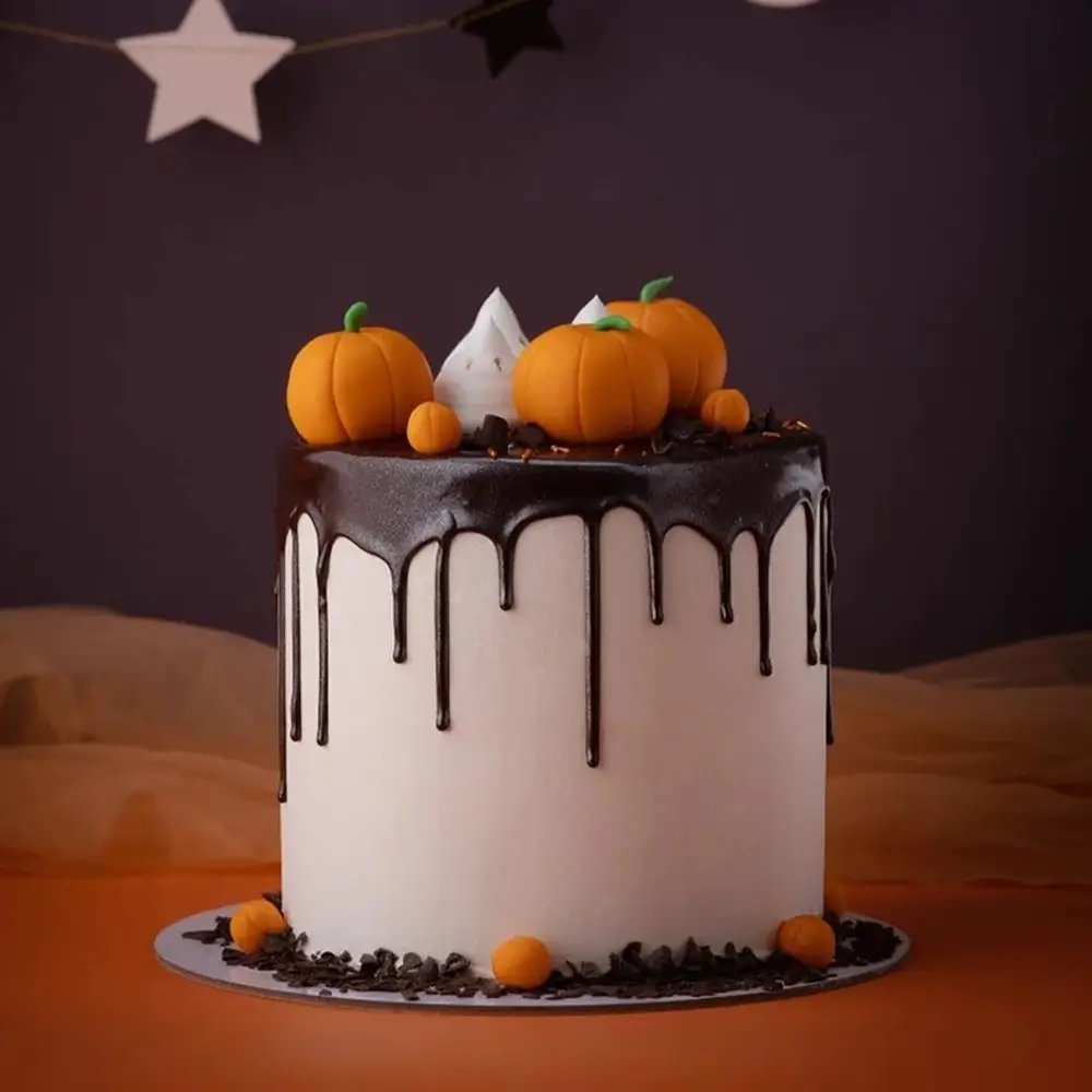A Halloween drip cake weighing 2 kg filled with chocolate ganache